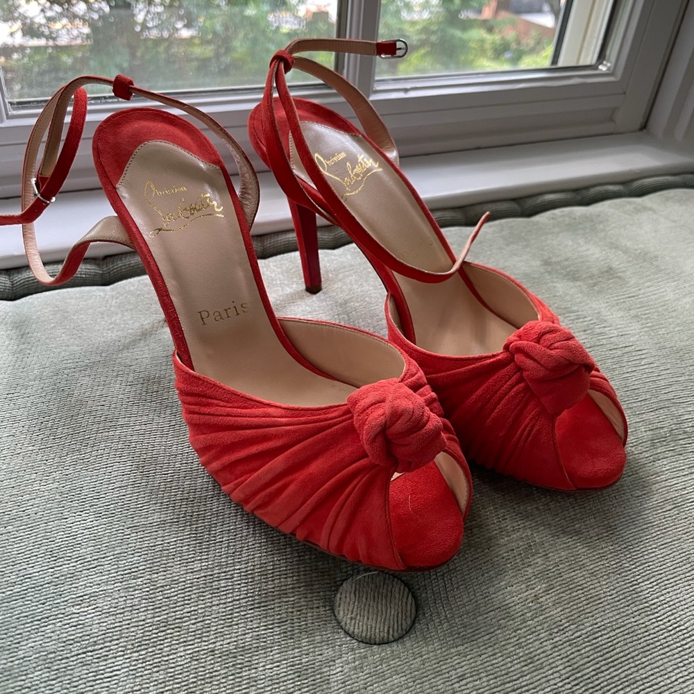 Louboutin peep toe pumps.